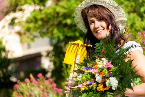 Healthy lawn and landscaped garden maintained by Kew gardening services