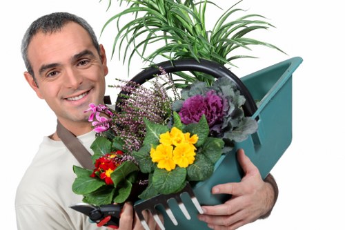 Seasonal planting and border care by gardeners in Kew